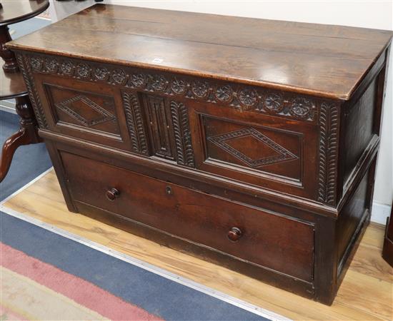 An 18th century carved oak mule chest W.126cm